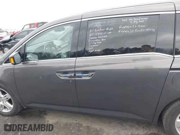 2012 Honda Odyssey Touring with VIN 5FNRL5H99CB071010, listed as a IAAI auction lot 41651233 with 186,913 mi miles. Bid and sale history available at carsss.com. Image 15.