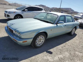 2000 Jaguar XJ with VIN SAJDA14C1YLF10459, listed as a Copart auction lot 65583394 with 113,333 mi miles and Salvage Title. Bid and sale history available at carsss.com. Image 1.