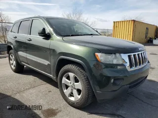 2011 Jeep Grand Cherokee Laredo with VIN 1J4RR4GG2BC636423, listed as a Copart auction lot 51169135 with 143,058 mi miles and Salvage Title. Bid and sale history available at DreamBid. Image 4.