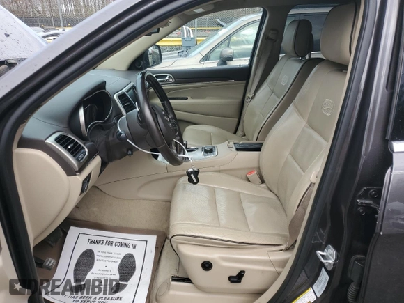 2015 Jeep Grand Cherokee Overland with VIN 1C4RJFCG0FC848046, listed as a Copart auction lot 49514795 with 212,688 mi miles and Clean title. Bid and sale history available at DreamBid. Image 7.