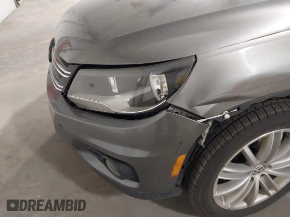 2012 Volkswagen Tiguan S with VIN WVGBV7AX2CW002991, listed as a IAAI auction lot 42031877 with 205,979 mi miles and . Bid and sale history available at DreamBid. Image 6.