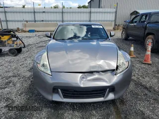 2009 Nissan 370Z z VIN JN1AZ44E69M409779, wystawiony jako Copart lot #55615955 z przebiegiem 132 674 mil mil oraz Szkoda całkowita • Salvage title. Historia ofert i sprzedaży dostępna na DreamBid. Obrazek 5.