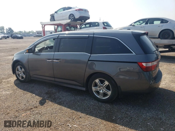 2012 Honda Odyssey Touring with VIN 5FNRL5H90CB505590, listed as a Copart auction lot 62566715 with 323,092 mi miles and Clean title. Bid and sale history available at DreamBid. Image 2.