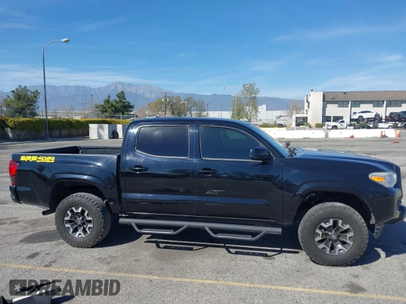 2018 Toyota Tacoma SR with VIN 3TMCZ5AN2JM127244, listed as a IAAI auction lot 41698199 with 61,535 mi miles and . Bid and sale history available at DreamBid. Image 13.