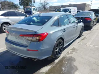 2022 Honda Civic Sport with VIN 2HGFE2F57NH600299, listed as a IAAI auction lot 41709059 with 9,060 mi miles and . Bid and sale history available at carsss.com. Image 4.