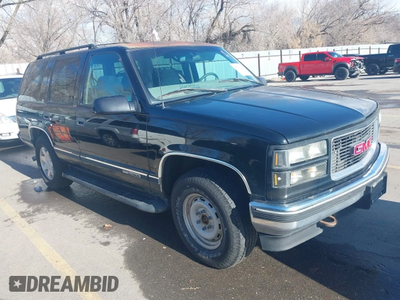 1997 GMC Yukon with VIN 1GKEK13R3VJ759103, listed as a IAAI auction lot 41726127 with 218,500 mi miles. Bid and sale history available at carsss.com. Image 1.