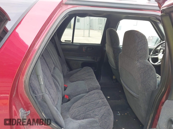 1999 GMC Jimmy SLE with VIN 1GKDT13W3X2504723, listed as a IAAI auction lot 41858184 with 239,227 mi miles. Bid and sale history available at carsss.com. Image 8.