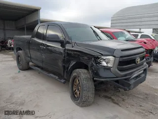 2014 Toyota Tundra 4WD Truck SR with VIN 5TFUM5F14EX051843, listed as a IAAI auction lot 41773983 with 145,089 mi miles. Bid and sale history available at carsss.com. Image 1.
