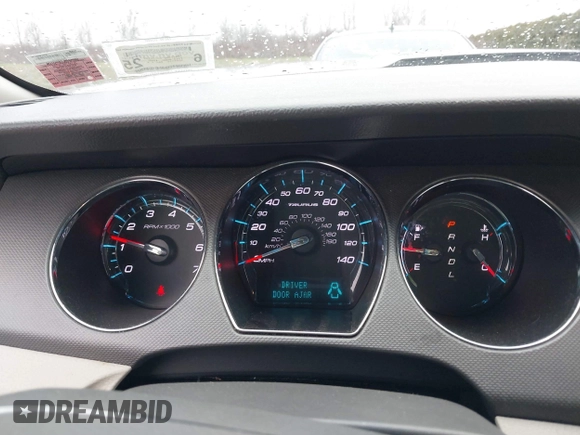 2011 Ford Taurus SE with VIN 1FAHP2DW7BG136988, listed as a IAAI auction lot 42002512 with 145,847 mi miles. Bid and sale history available at carsss.com. Image 7.