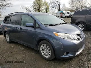 2015 Toyota Sienna XLE with VIN 5TDYK3DC4FS643475, listed as a Copart auction lot 52697405 with 153,808 mi miles and Salvage Title. Bid and sale history available at DreamBid. Image 4.