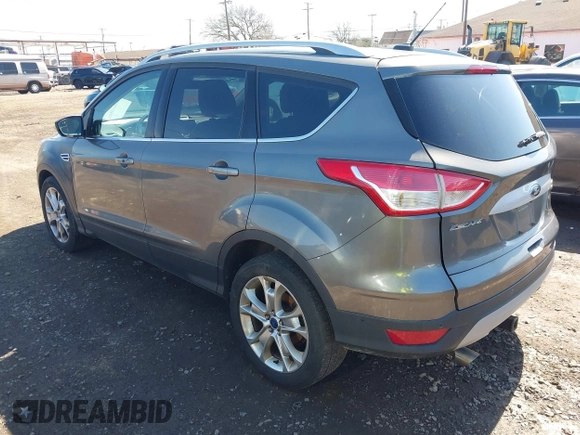 2014 Ford Escape Titanium with VIN 1FMCU9JX1EUB94776, listed as a IAAI auction lot 42063678 with 138,036 mi miles. Bid and sale history available at carsss.com. Image 3.