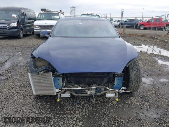 2017 Tesla Model S 100D with VIN 5YJSA1E25HF184502, listed as a IAAI auction lot 41834310 with 92,887 mi miles and . Bid and sale history available at DreamBid. Image 13.
