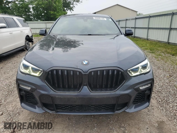 2021 BMW X6 M50i z VIN 5UXCY8C04M9D98591, wystawiony jako Copart lot #60606155 z przebiegiem 90 639 mil mil oraz Czysty tytuł • Clean title. Historia ofert i sprzedaży dostępna na DreamBid. Obrazek 5.