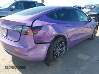 2020 Tesla Model 3 Standard Range Plus with VIN 5YJ3E1EA0LF739462, listed as a IAAI auction lot 42081889 with 65,254 mi miles. Bid and sale history available at carsss.com. Image 4.