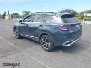 2023 Kia Sportage Hybrid EX with VIN KNDPVCAG5P7020209, listed as a IAAI auction lot 41409698 with 67,953 mi miles. Bid and sale history available at carsss.com. Image 3.