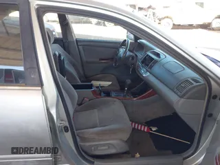 2003 Toyota Camry LE with VIN JTDBE32K730176610, listed as a IAAI auction lot 41627010 with 238,502 mi miles and . Bid and sale history available at DreamBid. Image 5.