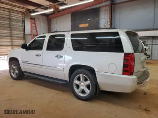 2014 Chevrolet Suburban LTZ with VIN 1GNSCKE0XER127997, listed as a Copart auction lot 42411525 with 228,690 mi miles and Salvage Title. Bid and sale history available at carsss.com. Image 2.