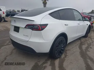 2022 Tesla Model Y Performance with VIN 7SAYGDEF0NF400560, listed as a IAAI auction lot 41783912 with 36,513 mi miles and . Bid and sale history available at DreamBid. Image 4.