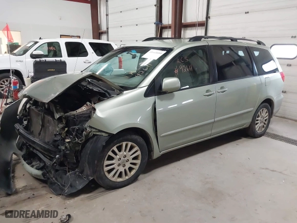 2009 Toyota Sienna XLE with VIN 5TDZK22C59S256844, listed as a IAAI auction lot 41668889 with 299,124 mi miles. Bid and sale history available at carsss.com. Image 17.