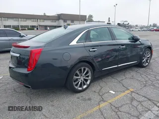 2013 Cadillac XTS Luxury with VIN 2G61P5S33D9215214, listed as a IAAI auction lot 42170402 with 132,045 mi miles and . Bid and sale history available at DreamBid. Image 4.