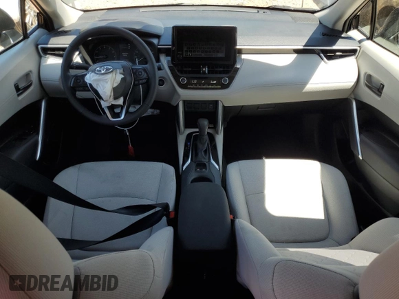 2023 Toyota Corolla Cross LE with VIN 7MUCAAAG3PV058094, listed as a Copart auction lot 57983105 with 30,593 mi miles and Salvage title. Bid and sale history available at DreamBid. Image 8.