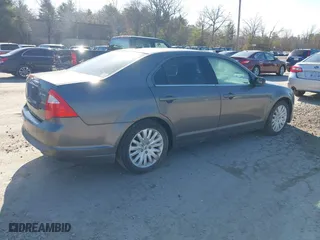 2011 Ford Fusion Hybrid with VIN 3FADP0L36BR114063, listed as a IAAI auction lot 42013961 with 141,255 mi miles. Bid and sale history available at carsss.com. Image 4.