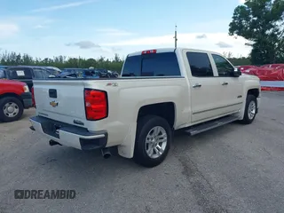2014 Chevrolet Silverado 1500 High Country with VIN 3GCUKTEC4EG401571, listed as a IAAI auction lot 41984349 with 104,221 mi miles and . Bid and sale history available at DreamBid. Image 4.