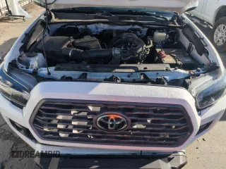 2020 Toyota Tacoma SR5 z VIN 5TFCZ5AN9LX230688, wystawiony jako Copart lot #55305165 z przebiegiem 50 381 mil mil oraz Szkoda całkowita • Salvage title. Historia ofert i sprzedaży dostępna na DreamBid. Obrazek 11.