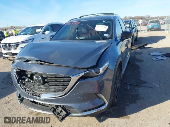 2022 Mazda CX-9 Grand Touring with VIN JM3TCBDYXN0625567, listed as a IAAI auction lot 41327380 with 50,672 mi miles and . Bid and sale history available at DreamBid. Image 2.
