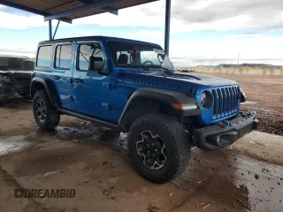 2023 Jeep Wrangler Rubicon with VIN 1C4JJXR69PW581362, listed as a Copart auction lot 58557795 with 34,357 mi miles and Salvage title. Bid and sale history available at DreamBid. Image 4.