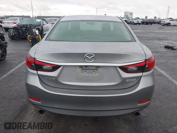 2014 Mazda 6 i Touring with VIN JM1GJ1V60E1141831, listed as a IAAI auction lot 42131200 with 86,597 mi miles and . Bid and sale history available at DreamBid. Image 16.