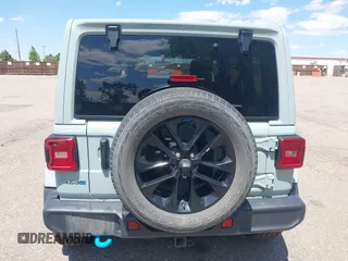 2023 Jeep Wrangler Sahara with VIN 1C4JJXP68PW627007, listed as a IAAI auction lot 42474745 with 57,912 mi miles and . Bid and sale history available at DreamBid. Image 16.