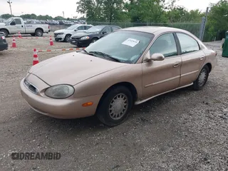 1996 Mercury Sable LS z VIN 1MELM53S1TG638988, wystawiony jako IAAI lot #42523616 z przebiegiem 87 087 mil mil oraz . Historia ofert i sprzedaży dostępna na DreamBid. Obrazek 2.