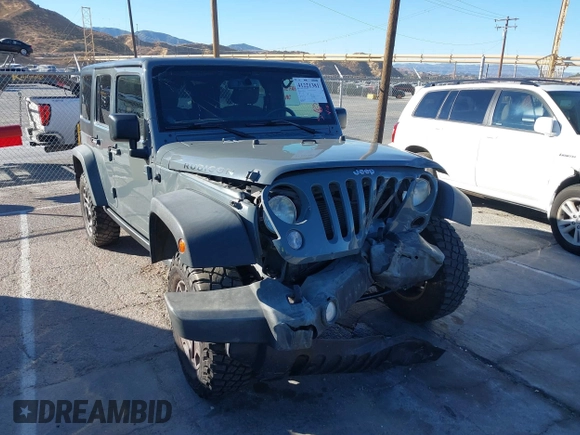 2014 Jeep Wrangler Unlimited Rubicon X with VIN 1C4BJWFG3EL134522, listed as a IAAI auction lot 41221381 with 66,897 mi miles and . Bid and sale history available at DreamBid. Image 1.
