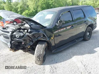 2013 Chevrolet Tahoe Commercial with VIN 1GNLC2E00DR265941, listed as a IAAI auction lot 42289977 with 206,840 mi miles and . Bid and sale history available at DreamBid. Image 20.