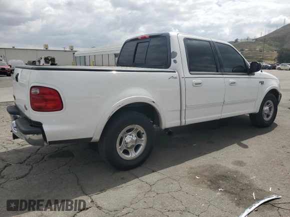 2002 Ford F-150 XLT with VIN 1FTRW07L52KA04929, listed as a Copart auction lot 54491815 with 169,132 mi miles and Salvage Title. Bid and sale history available at carsss.com. Image 3.