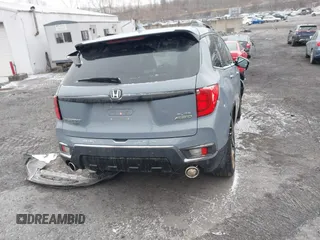 2022 Honda Passport Elite z VIN 5FNYF8H06NB015583, wystawiony jako IAAI lot #41633925 z przebiegiem 49 738 mil mil oraz . Historia ofert i sprzedaży dostępna na DreamBid. Obrazek 16.