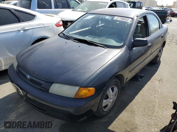 1997 Mazda Protege DX z VIN JM1BC1412V0157268, wystawiony jako Copart lot #61380564 z przebiegiem 85 356 mil mil oraz Szkoda całkowita • Salvage title. Historia ofert i sprzedaży dostępna na DreamBid. Obrazek 1.