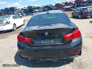 2016 BMW M4 with VIN WBS3R9C51GK708621, listed as a IAAI auction lot 41678133 with 59,501 mi miles. Bid and sale history available at carsss.com. Image 16.