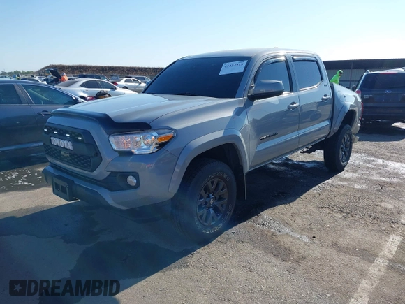 2021 Toyota Tacoma SR5 with VIN 5TFAZ5CN7MX101810, listed as a IAAI auction lot 42454418 with 58,930 mi miles and . Bid and sale history available at DreamBid. Image 2.