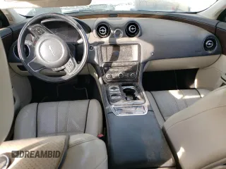 2014 Jaguar XJ with VIN SAJWA2GZ7E8V69543, listed as a Copart auction lot 86390204 with 110,929 mi miles and Salvage Title. Bid and sale history available at carsss.com. Image 8.