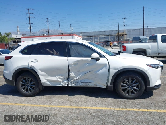 2020 Mazda CX-9 Sport with VIN JM3TCABY1L0406720, listed as a IAAI auction lot 42304144 with 75,887 mi miles and . Bid and sale history available at DreamBid. Image 13.
