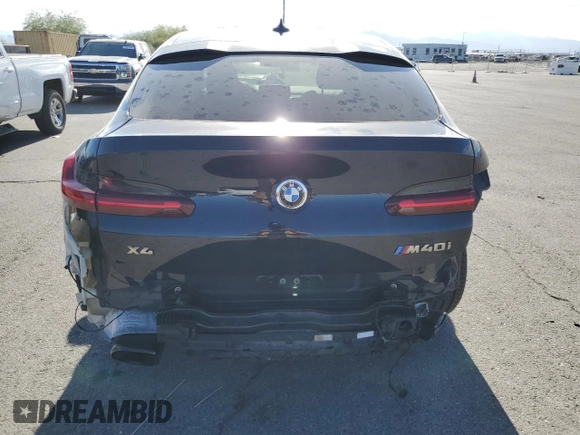 2021 BMW X4 M40i with VIN 5UX2V5C06M9E04443, listed as a Copart auction lot 72061194 with 71,637 mi miles and Salvage title. Bid and sale history available at DreamBid. Image 6.
