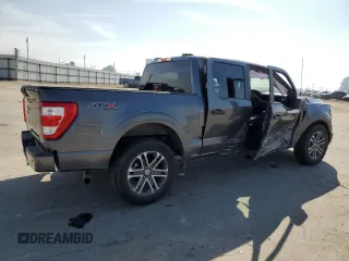 2023 Ford F-150 XL with VIN 1FTEW1CP4PKD21685, listed as a Copart auction lot 54992615 with 27,252 mi miles and Salvage title. Bid and sale history available at DreamBid. Image 3.