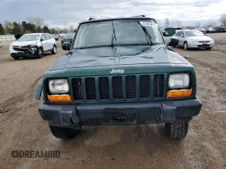 2000 Jeep Cherokee with VIN 1J4FF48S3YL149593, listed as a Copart auction lot 52489045 with 290,231 mi miles and Salvage title. Bid and sale history available at DreamBid. Image 5.