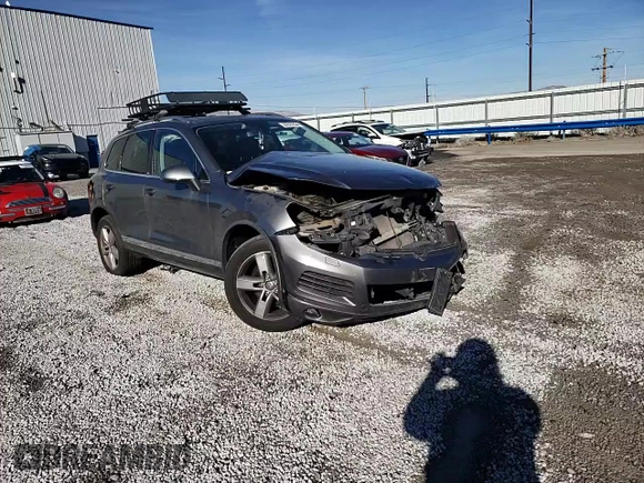 2014 Volkswagen Touareg Lux z VIN WVGEF9BP1ED007974, wystawiony jako Copart lot #82627834 z przebiegiem Nie podano mil oraz Szkoda całkowita • Salvage title. Historia ofert i sprzedaży dostępna na DreamBid. Obrazek 11.