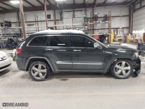 2011 Jeep Grand Cherokee Overland with VIN 1J4RR6GTXBC701186, listed as a IAAI auction lot 41553697 with 172,317 mi miles. Bid and sale history available at carsss.com. Image 13.