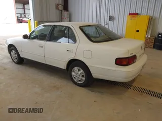 1996 Toyota Camry DX with VIN JT2BG12K3T0401659, listed as a IAAI auction lot 41874795 with 169,406 mi miles. Bid and sale history available at carsss.com. Image 3.