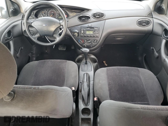 2001 Ford Focus LX with VIN 1FAHP33P01W332260, listed as a Copart auction lot 83221654 with 104,028 mi miles and Salvage Title. Bid and sale history available at DreamBid. Image 8.