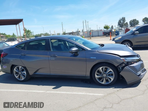 2018 Honda Clarity Touring z VIN JHMZC5F33JC021811, wystawiony jako IAAI lot #42272808 z przebiegiem 82 414 mil mil oraz . Historia ofert i sprzedaży dostępna na DreamBid. Obrazek 13.